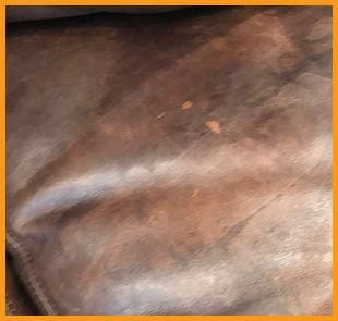 A RH leather seat visibly stained with water spots that have seeped into the absorbent aniline leather, highlighting the need of stain removal and for our complete Leather Restoration service. A RH leather seat visibly stained with water spots that have seeped into the absorbent aniline leather, highlighting the need of stain removal and for our complete Leather Restoration service.