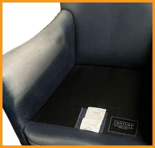 Cracked and dried leather cushion on a blue chair Cracked and dried leather cushion on a blue chair