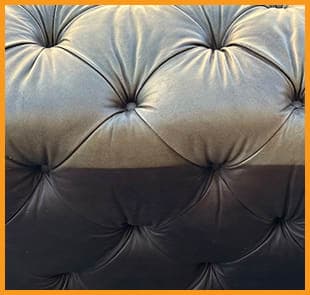 A comparison of sun-faded and original leather on a tufted Restoration Hardware couch, highlighting the contrast between the exposed and covered areas. It needs our Leather Restoration service. A comparison of sun-faded and original leather on a tufted RH couch, highlighting the contrast between the exposed and covered areas. It needs our Leather Restoration service.